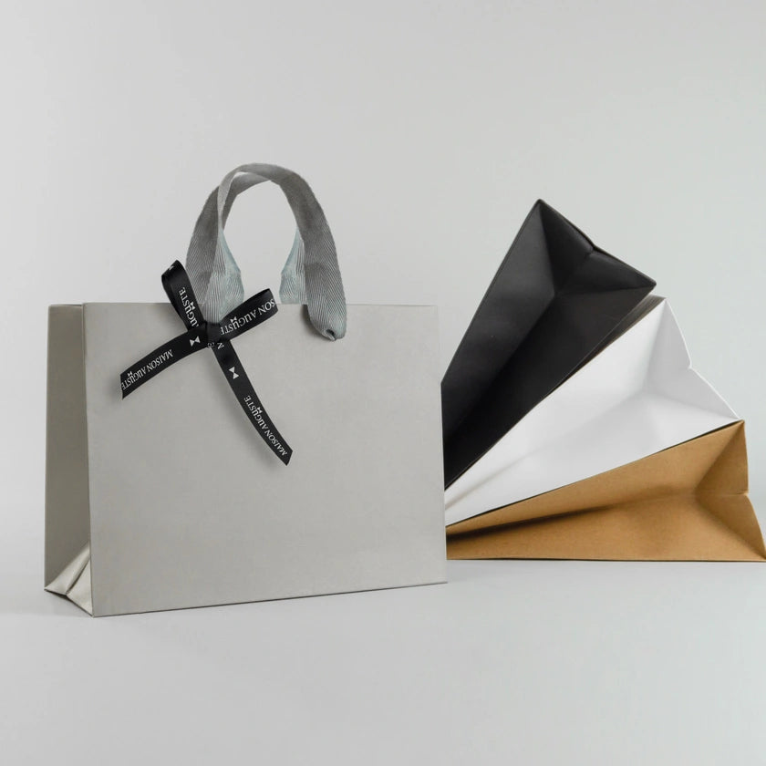 Luxury embossed paper gift bag in bronze