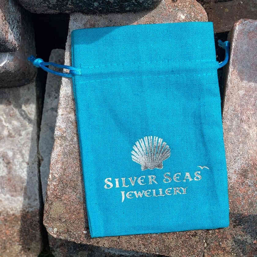 Small branded cotton gift pouch for retail packaging