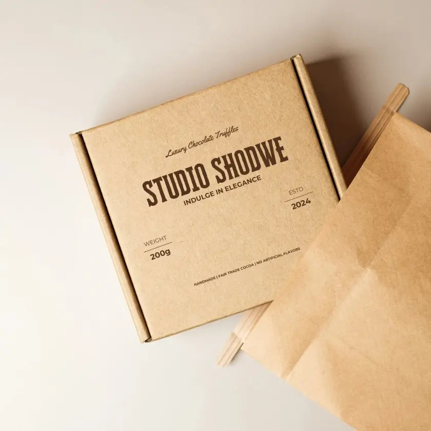 Brown cardboard box with 'Studio Shodwe' branding on a light background