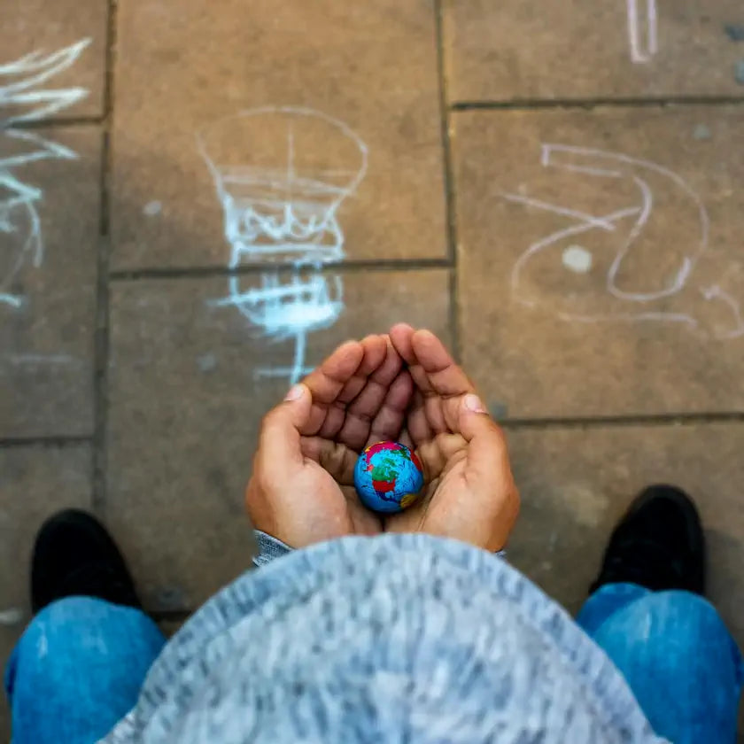 Holding miniature globe