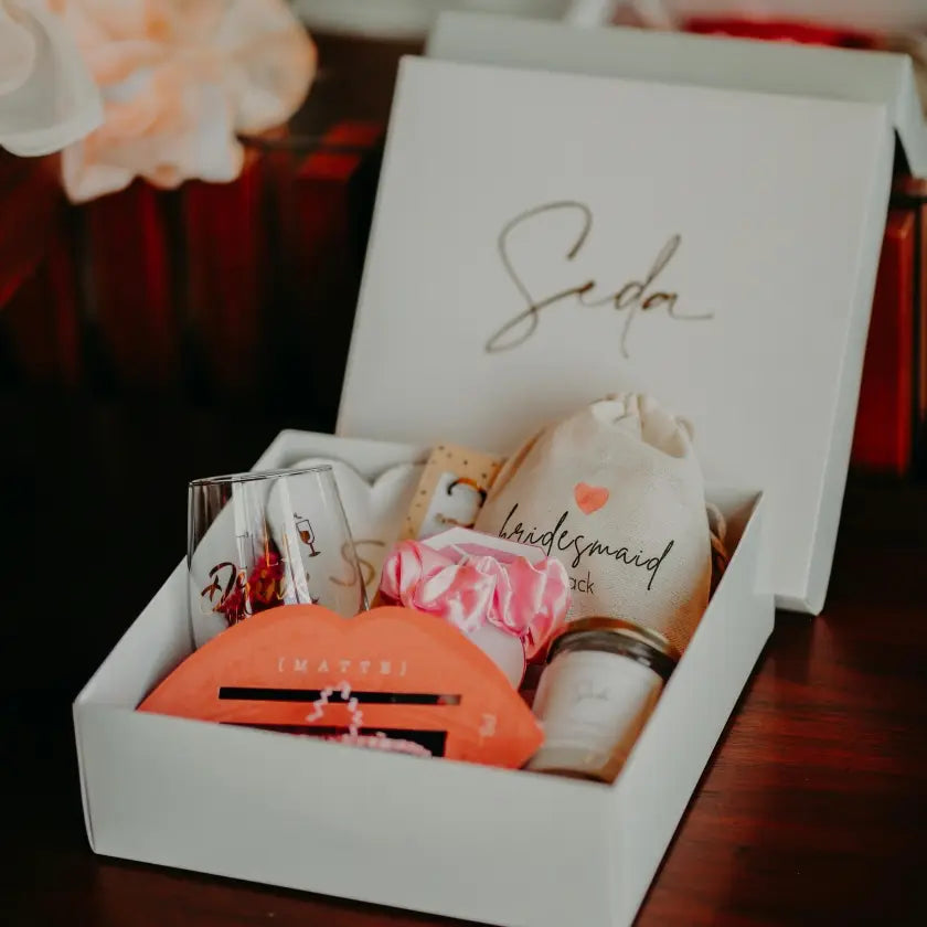 A white bridesmaid gift box titled 