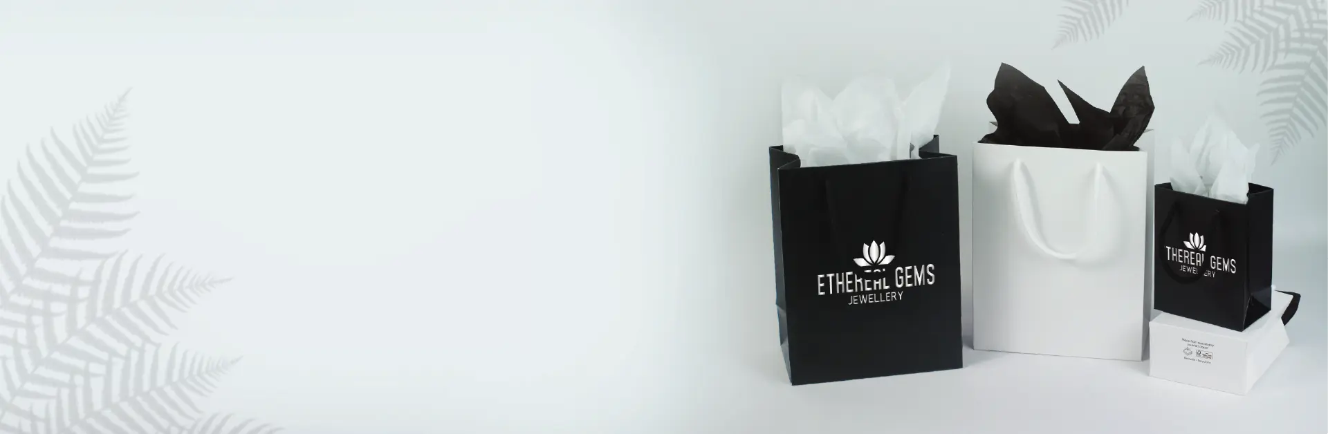 Black and white eco-friendly paper gift bags with tissue paper