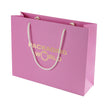 Pink paper bag with 'Packaging World' text on a white background