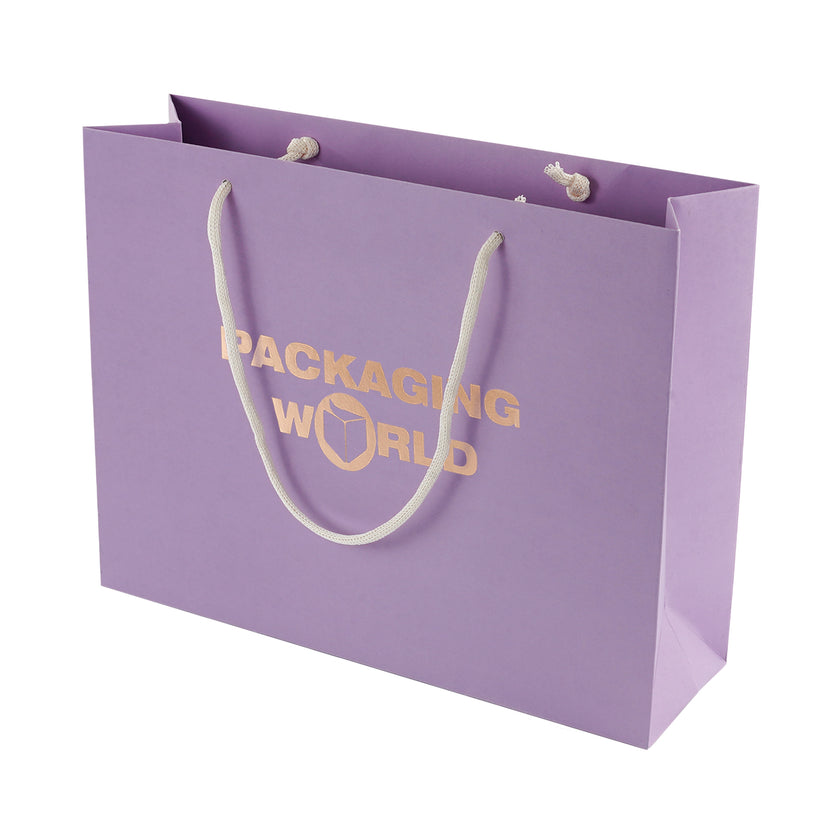 Purple paper bag with 'Packaging World' text and white handles on a white background