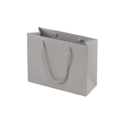Grey eco-friendly paper gift bag with braided rope handles.