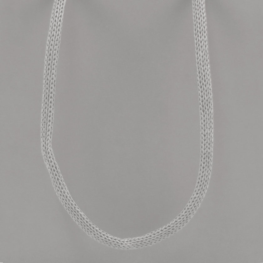 Grey eco-friendly paper gift bag with braided rope handles.