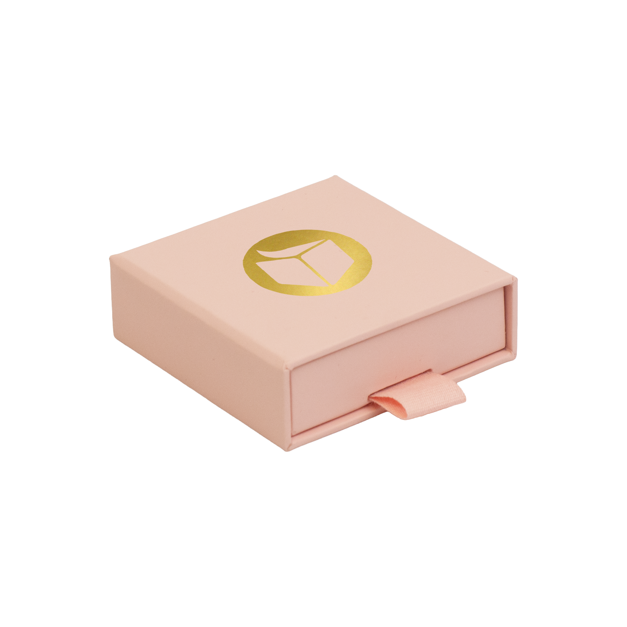 A light pink square gift box with a pull tab and a gold circular logo on top, shown on a plain white background.