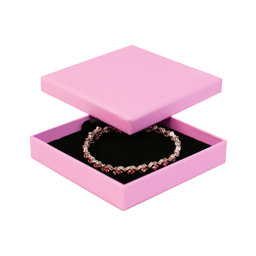 Pink square recyclable eco kraft box with jewellery item.