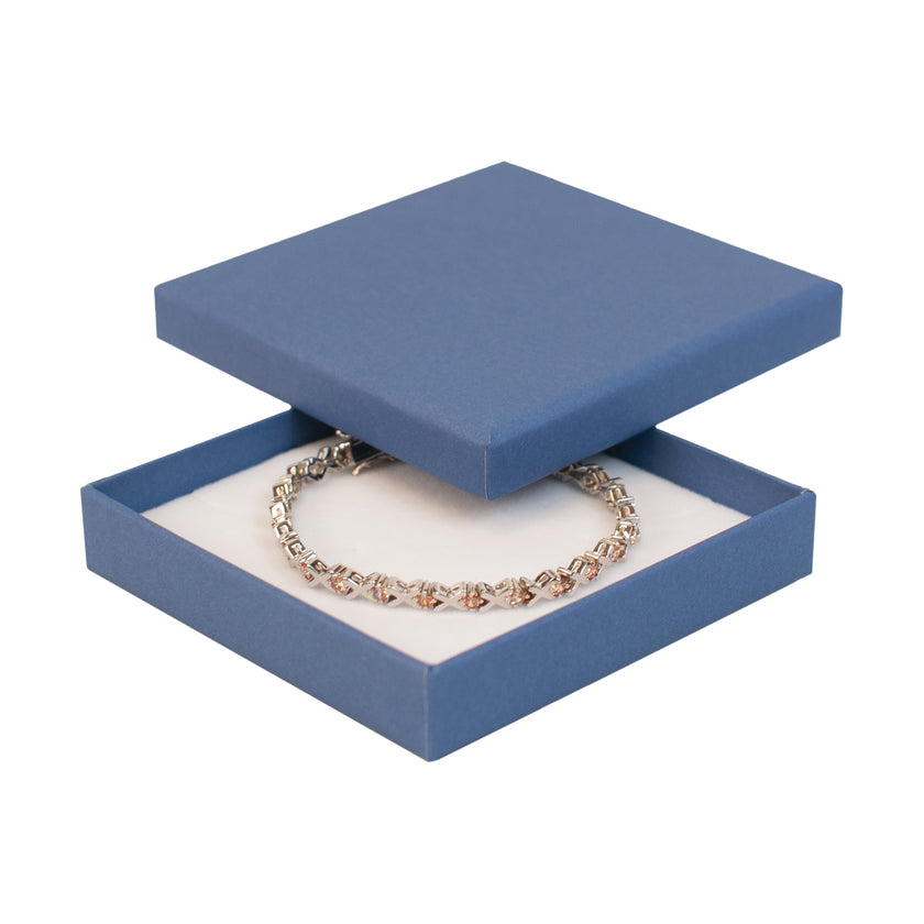 Blue square recyclable eco kraft box with jewellery item.