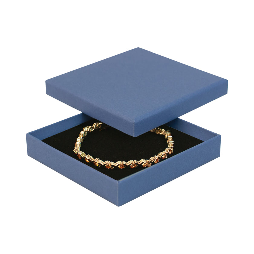 Blue square recyclable eco kraft box with jewellery item.