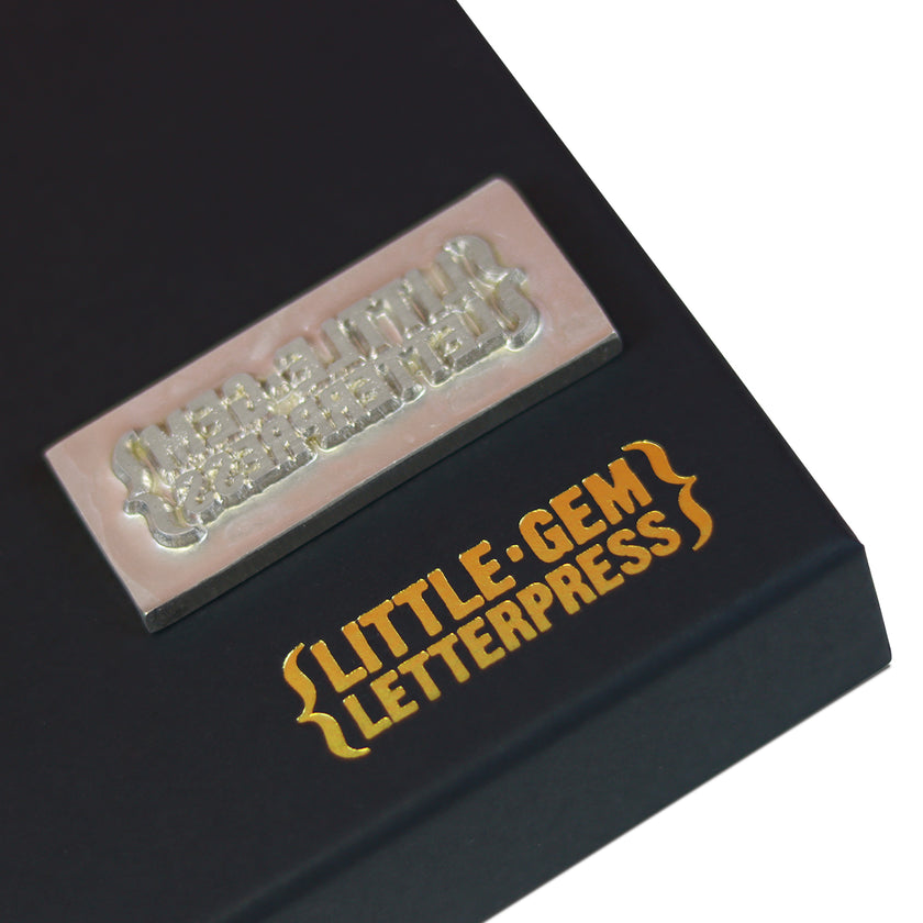 Black box with 'Little Gem Letterpress' branding and decorative elements.