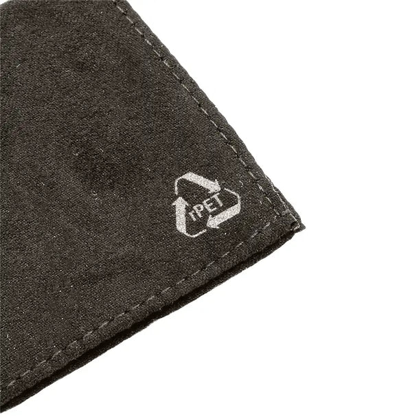 Close-up of a dark gray textured fabric corner with visible stitching and a small white PET recycling symbol printed near the edge, shown on a white background.
